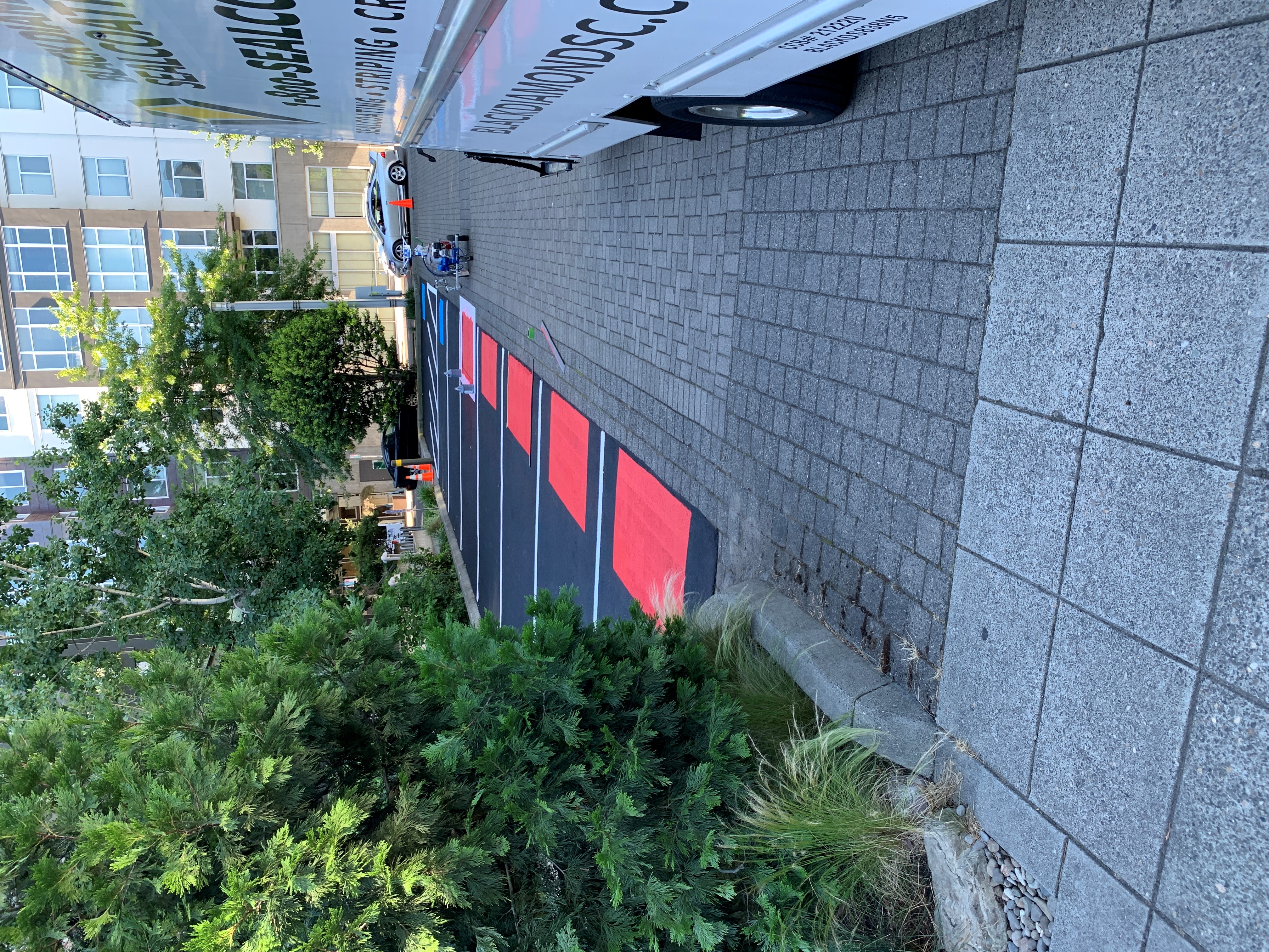 Black Diamond Seal Coat branded truck on job site in Portland